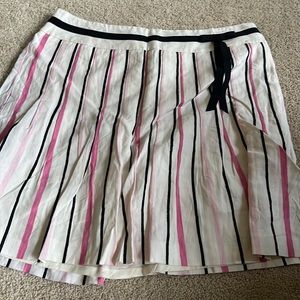 white skirt with pink and black stripes with black bow detail